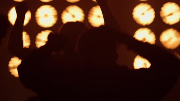 Partying Crowd Dancing Rock Concert in Spotlights alt