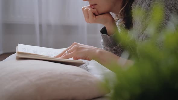 Young woman reading a book