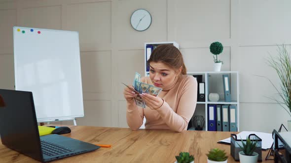 Satisfied Office Worker Counting Hundred Dollar Banknotes alt