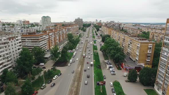 Aerial View of Samara City, Cars and Trams Moving Over Road, Apartment Houses in Summer Day