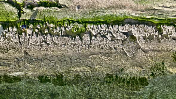 Texture of the rocky beach aerial view 4 K Turkey Alanya alt