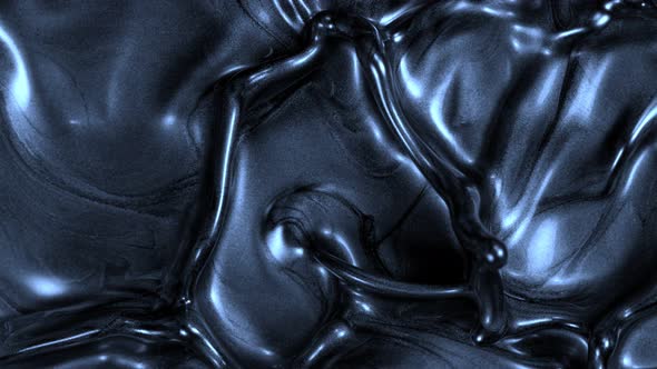 Super Slow Motion Shot of Splashing Blue Metallic Color Background at 1000Fps alt