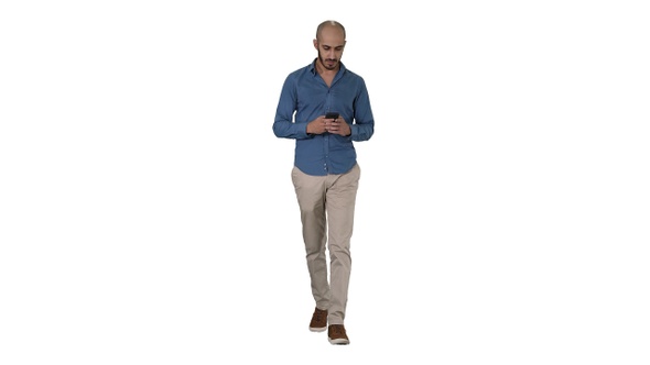 Man text messaging while walking on white background alt