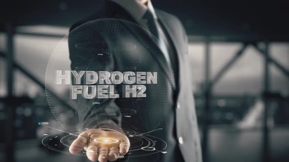 Businessman with Hydrogen Fuel H2 Hologram Concept alt