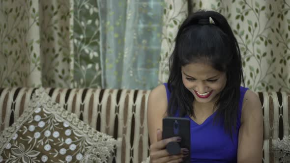 Indian Girl Laughing While Video Calling