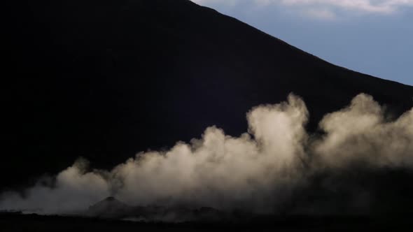iceland landscape, geothermal hotspring steam smoke, camera pan from left to right following movemen alt