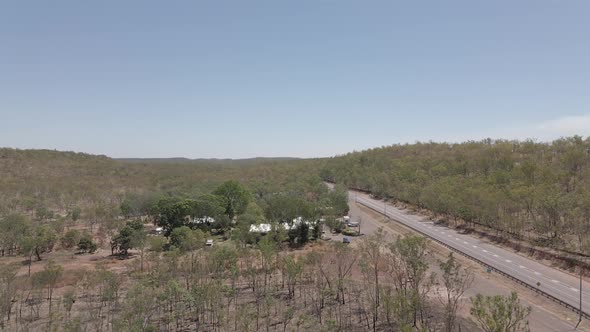 Moving drone shot of House and road in Northern Territory, Australian Outback alt