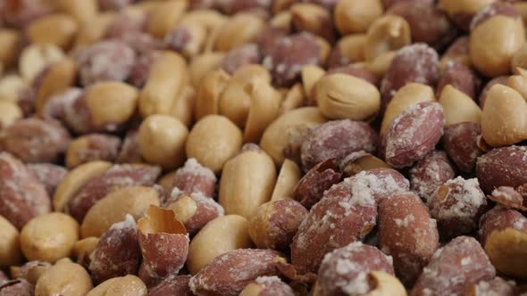 Pile of roasted groundnuts on white background 4K 2160p 30fps UltraHD footage - Arachis hypogaea tas alt