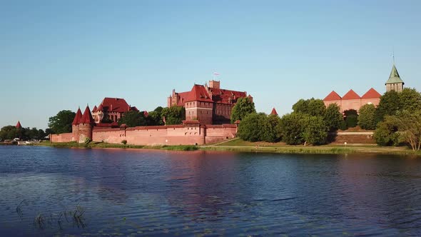 Aerial: The Castle of Malbork in Poland, summer time alt