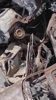 Vertical Video of a Dump of Destroyed Cars During the War in Ukraine alt