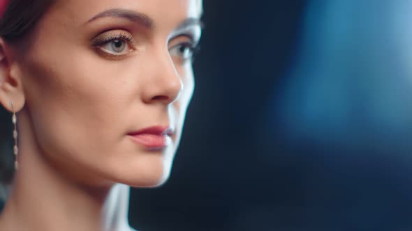 Sexy Naked Woman in Jewelry Posing at Black Light Bokeh Background alt