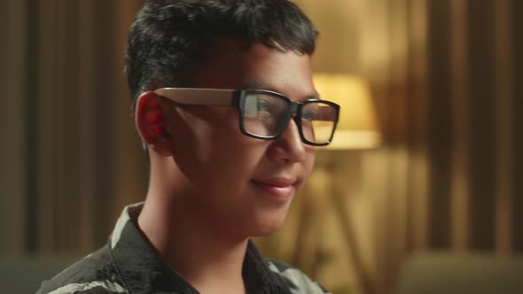 Close Up Asian Boy Student Distance Learning And Writing With Computer From Home alt