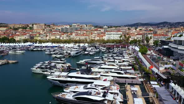 Cannes a city on the French Riviera. Clear blue water, boats, yachts and sailing ships.