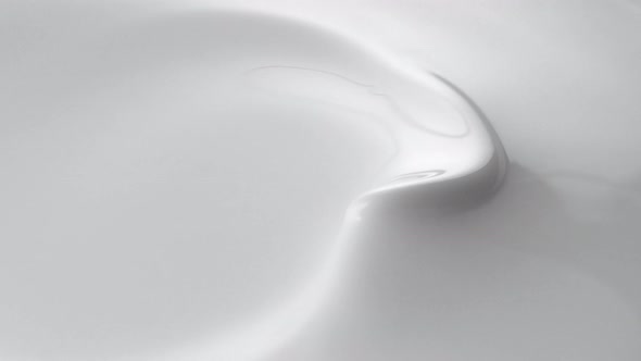 Swirl in milky liquid surface. Slow Motion. alt