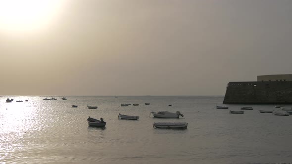 Anchored boats in a bay alt