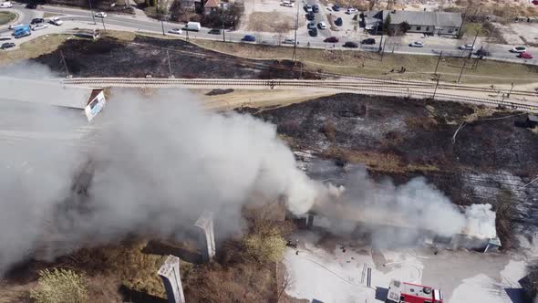 Aerial View Of Firemen Calming The Fire In A Building 4K