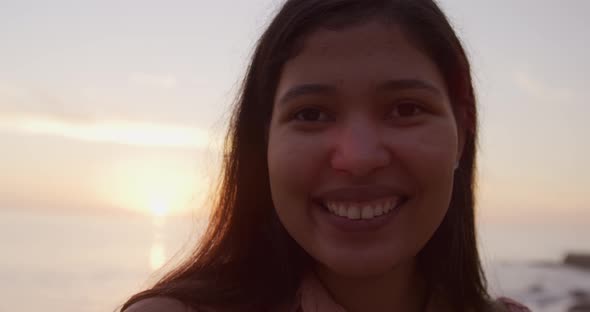 Young woman smiling at the camera alt