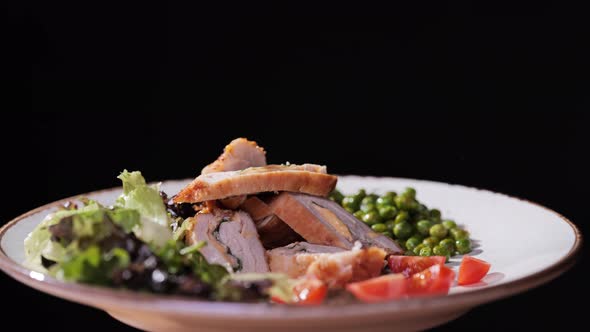 Roasted Meat with Peas and Salad