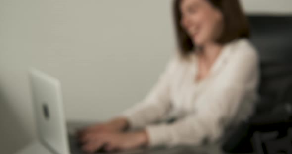 Blurred Cheerful Woman Manager Working in the Office Female Accountant at Work Administrator Using