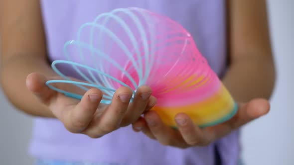 Trend Slinky rainbow toy from the '90s. A multicolored children's spiral toy.