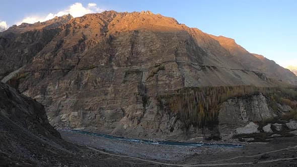 Pan Right View Of Rugged Skardu Valley With Winding River Flowing Through alt