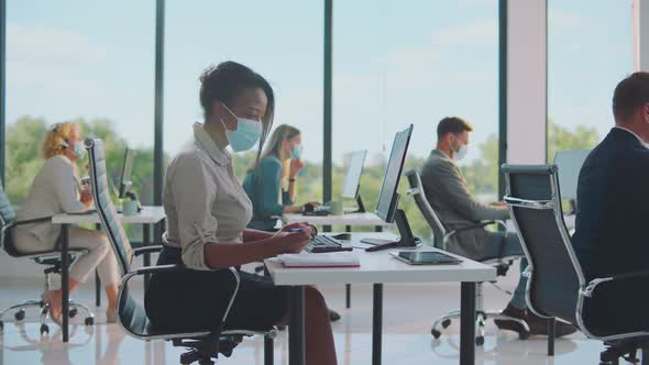 Attractive black woman making notes alt