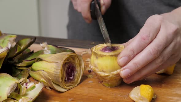 Woman Cut Artichoke alt