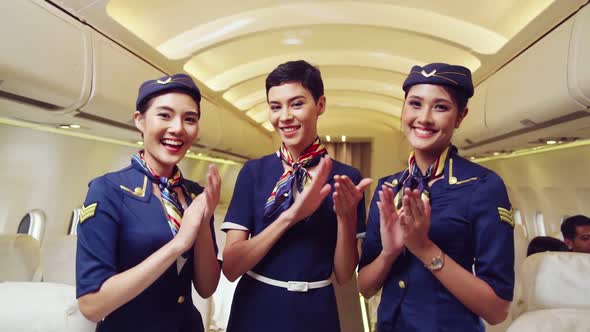 Cabin Crew Clapping Hands in Airplane alt