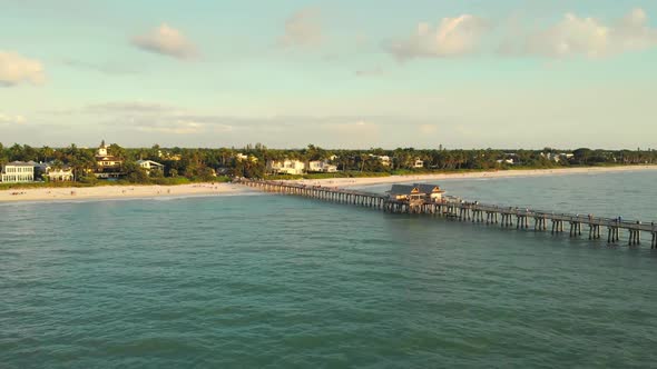 Naples Beach and Fishing Pier at Sunset, Florida.