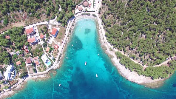 Aerial view of people swimming in turquoise waters of island of Brac, Croatia alt