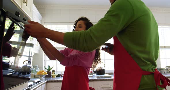 Couple making Christmas cookies at home 4k alt