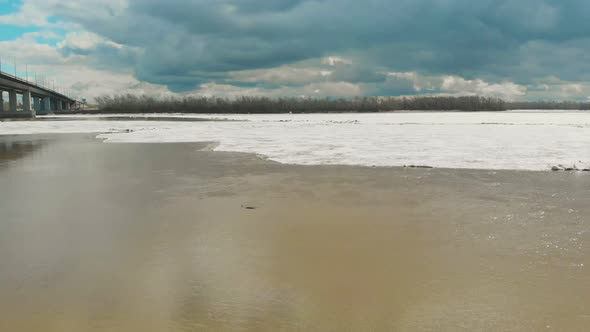 Landscape of Broad Partly Melted From Ice Running River alt