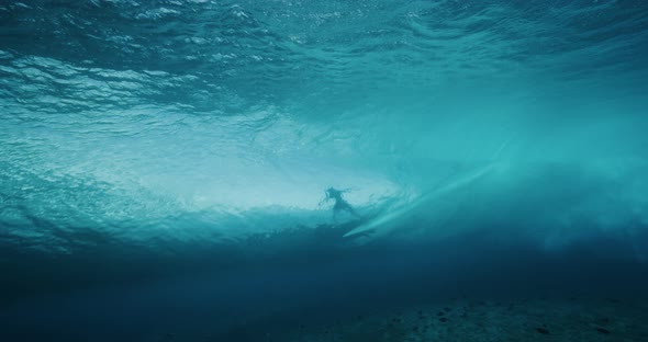 Surfing silhouette in the barrel alt