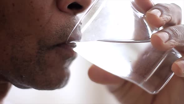 man drinking water from a glass on white background stock video stock footage alt