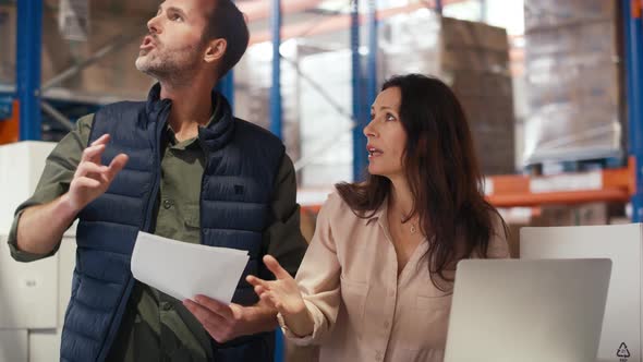 Meeting of caucasian mature people in a warehouse. Shot with RED helium camera in 8K. alt