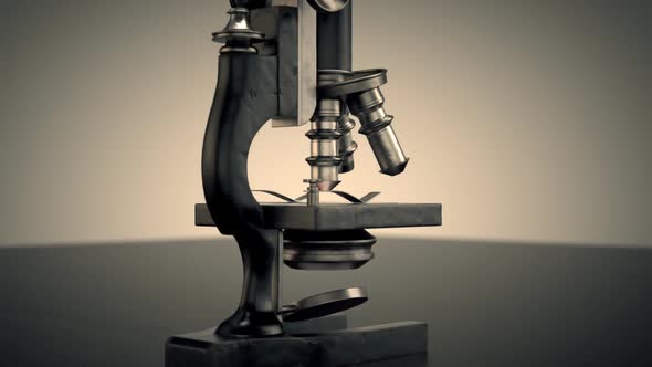 A vintage microscope used to study and analyze microbes, bacteria and cells.