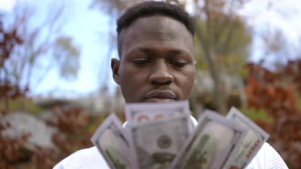 Closeup Front View Proud Rich African American Man with Cash Money Outdoors alt