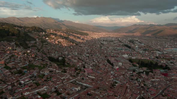 4k aerial drone panoramic view during the daytime, before sunset of the central Cusco, capital of th alt