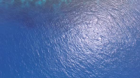 Aerial view of luxury resort with bungalow overwater, Maldives island. alt