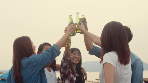Group of Asia best friends teenagers salute and cheers toast of bottle  beer enjoy party with happy.