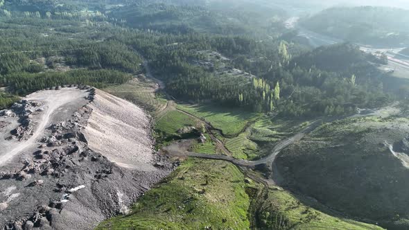 Tunnel development in the mountains aerial view 4 K alt