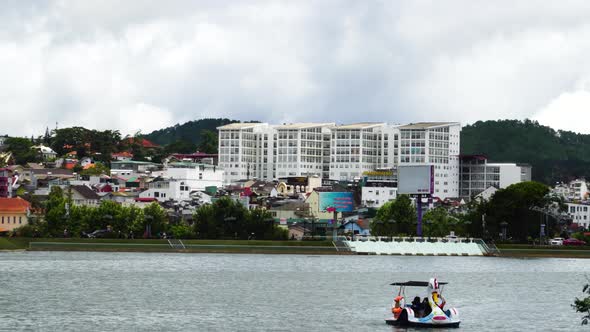 Static view of colorful Da Lat downtown from the lake. Vietnam alt