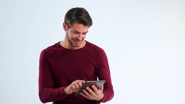 Portrait of smiling man using digital tablet 4k alt