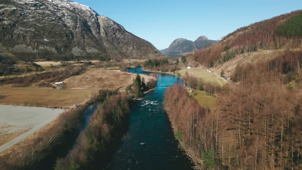 Drone flight up Ardals River in picturesque rural countryside, Norway alt