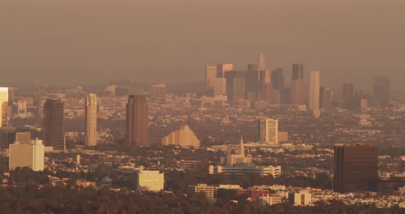 Helicopter aerial moving forward over freeway, traffic below, day
