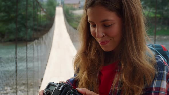 Smiling Girl Enjoy Photographing Beautiful Nature alt