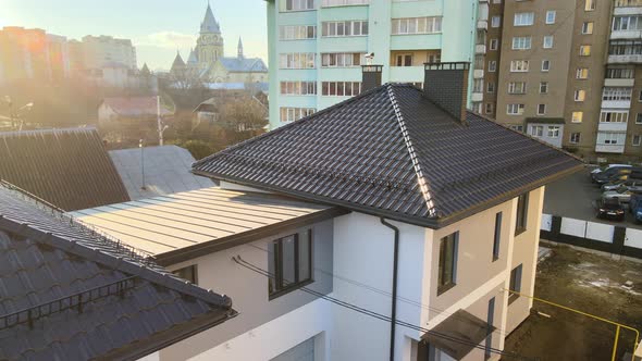 Aerial View of Private House with Ceramic Shingles Covered Roof Top alt