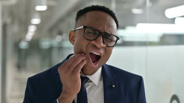 Portrait of Sick African Businessman Having Toothache alt