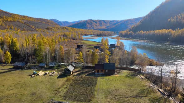 Remote Village on the Bank of the River Beautiful Nature Flying From a Copter