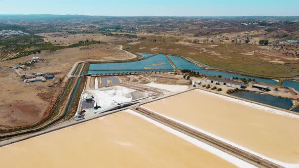 Salt Lakes or Saline Lakes during sunlight and agricultural countryside in background - Europe,Portu alt